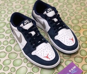 Nike-SB-Air-Jordan-1-Low-Eric-Koston-Midnight-Navy-Ember-Glow-CJ7891-400-Release-Date.jpg