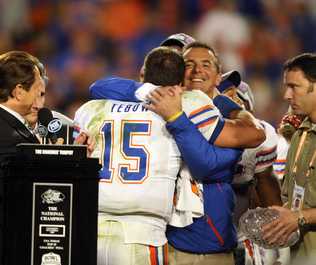 tebow-meyer-hugging-before-2008-championship-trophy1.jpg