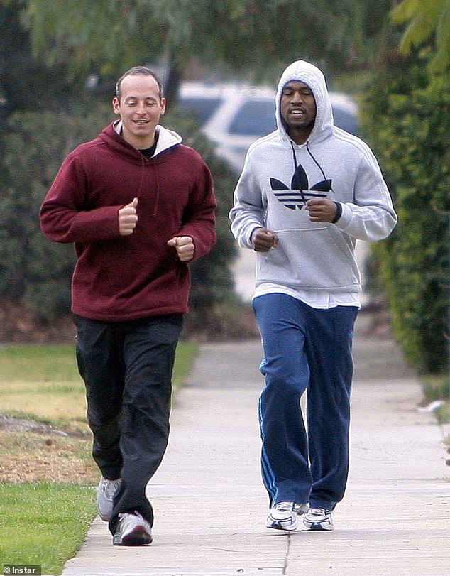 Claim; Kanye West believes his ex personal trainer Harley Pasternak has been following him in Dubai - one year after the rapper leaked alleged texts from his 'creepy' former employee threatening to get him 'institutionalized again' (pictured together 2016)