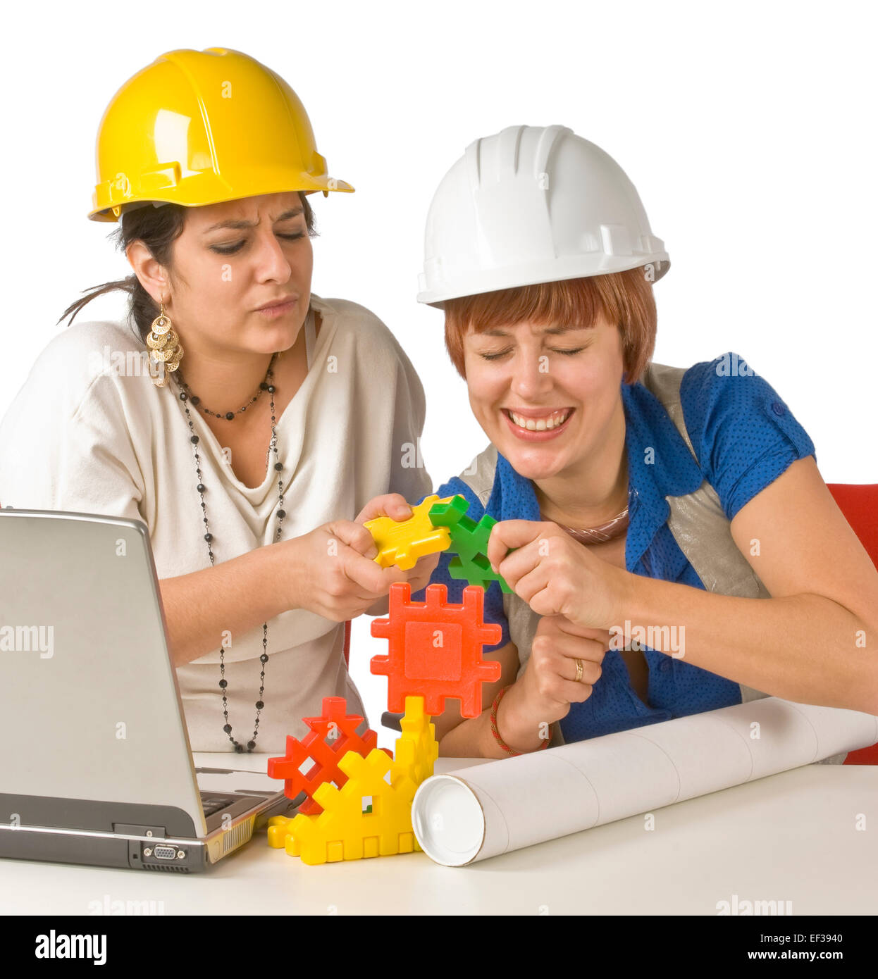 two-women-playing-with-childs-building-toy-EF3940.jpg