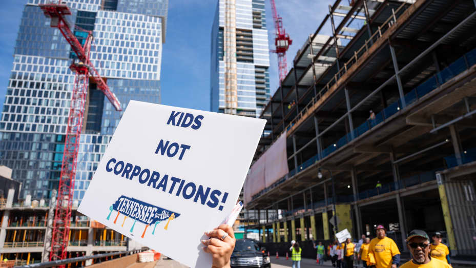 Educators and various organizations from across the state of Tennessee march to the Amazon headquarters in downtown Nashville in protest of Governor Bill Lee's school voucher program on March 12, 2024 in Nashville, Tennessee. Rural, urban, and suburban school districts across the state have passed resolutions opposing the program which they say would divert resources from Tennessee's already underfunded public schools.