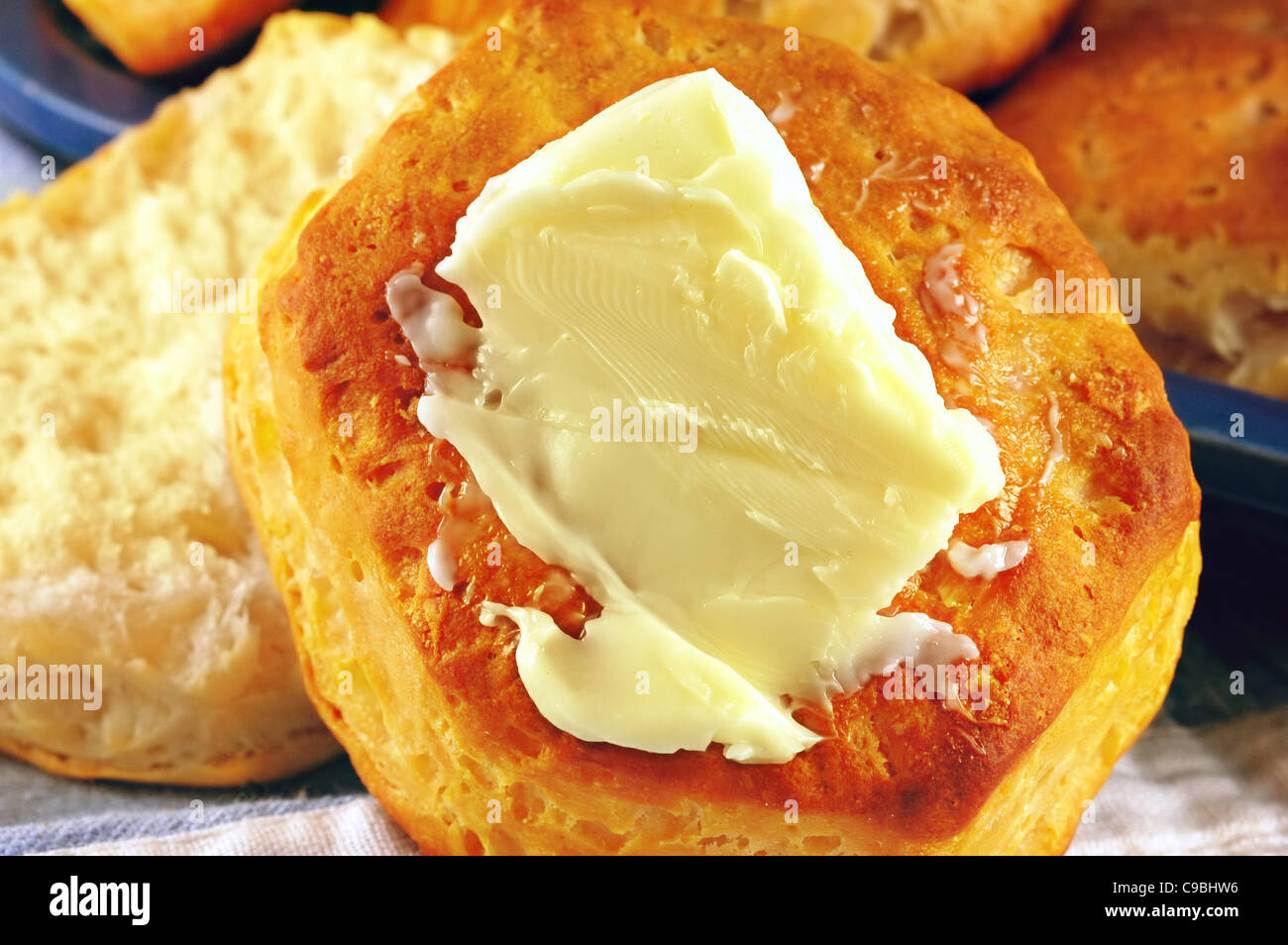 buttered-homemade-buttermilk-biscuits-with-vintage-blue-tableware-C9BHW6.jpg