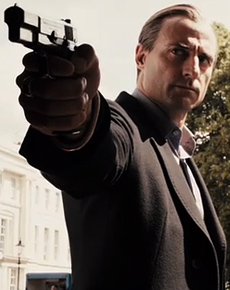 mark-strong-rocknrolla-gun-vert.jpg