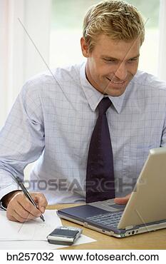 smiling-businessman-taking_~bn257032.jpg