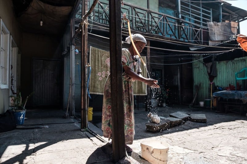 A woman washes her hands in the courtyard of her house in Addis Ababa, Ethiopia, on Nov. 1, 2018.